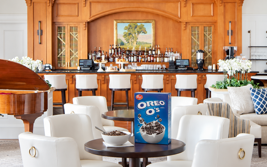 A bowl of Oreo O's cereal and a cereal box on a table in the Montage Laguna Beach lobby, where Omni Advertising's Honda and Connected TV teams discussed consumer behavior and automotive marketing strategy.